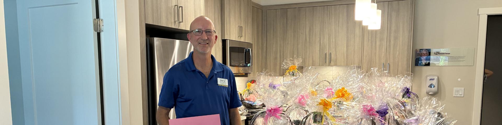 Save-On-Foods manager delivering gift baskets