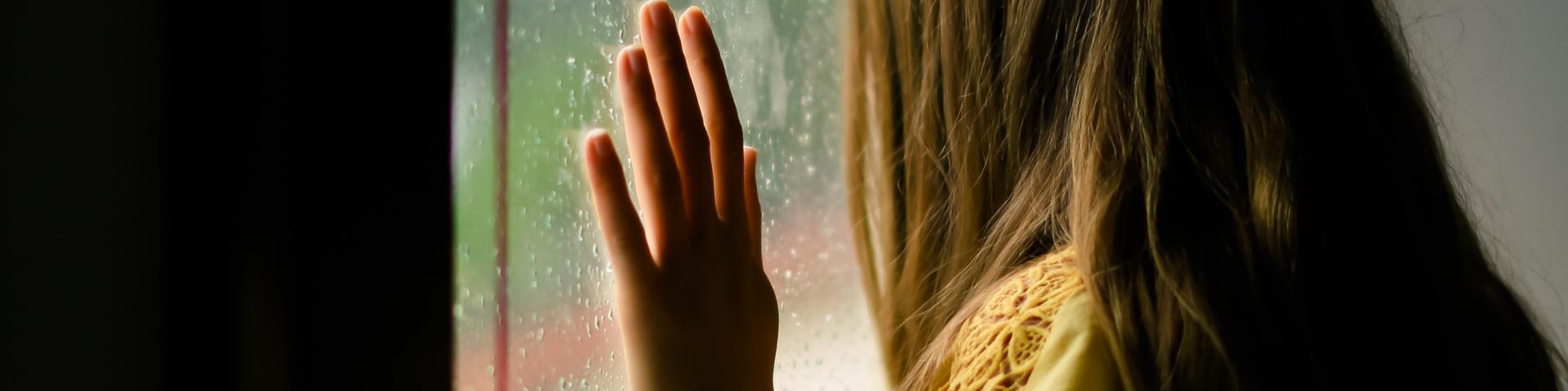 Woman looking outside the window