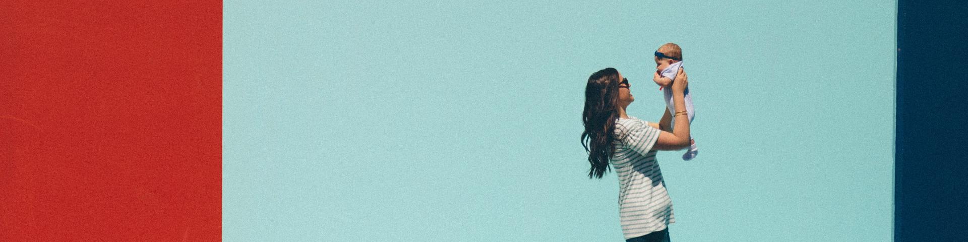 Woman carrying a baby while walking