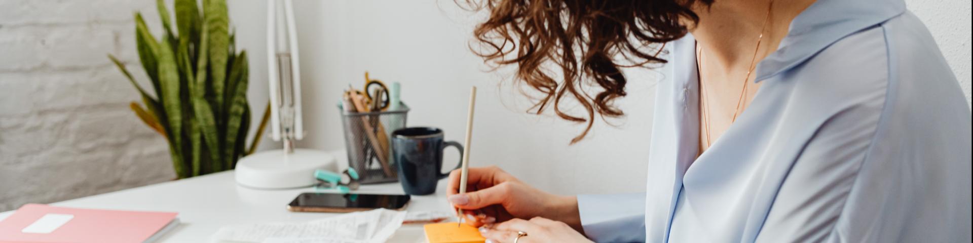 Women writing in journal 