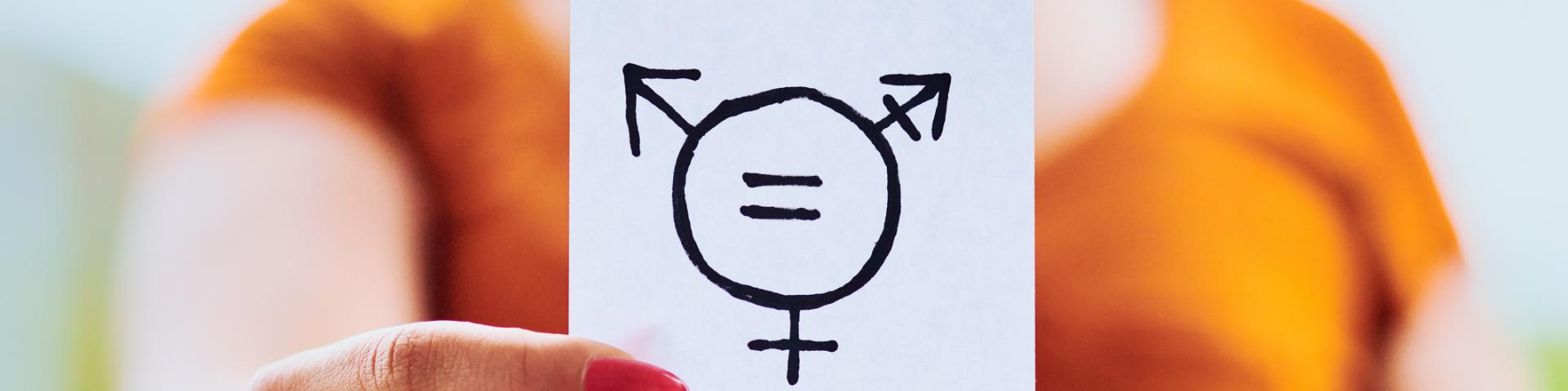 Person holding paper showing gender equality