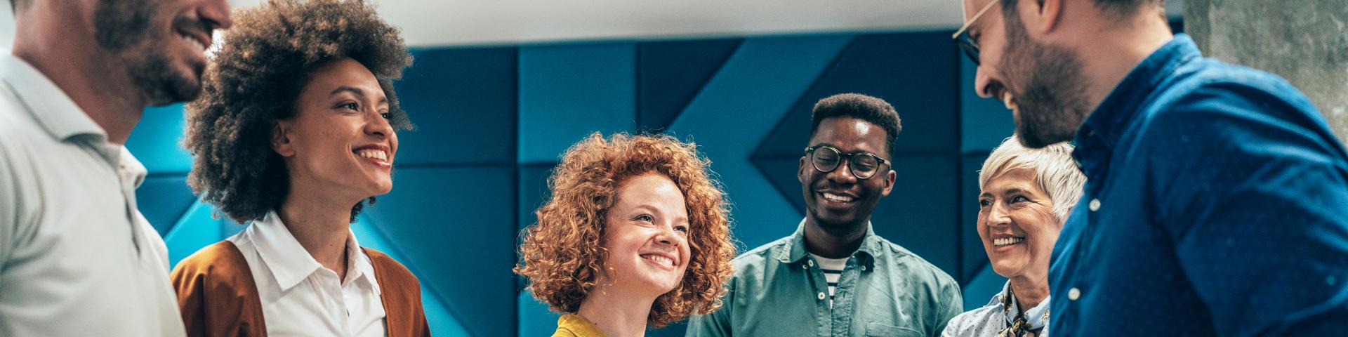 Happy businesswoman shaking hands with her colleague on a meeting in the office.