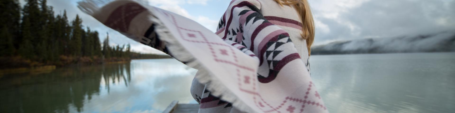 Coast Salish blanket in a scenic landscape