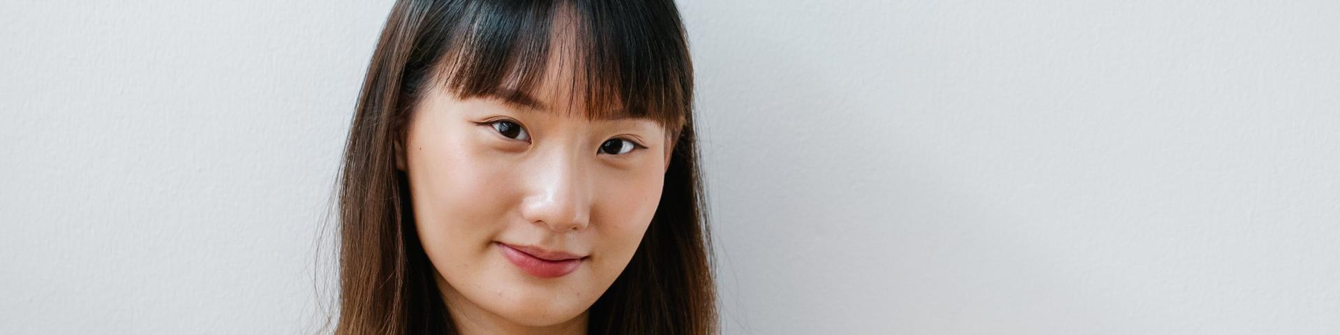 Japanese woman holding a matcha drink