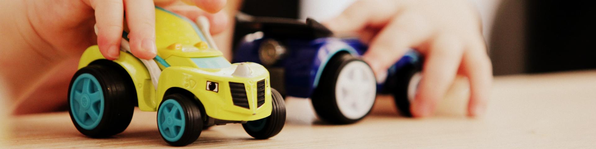 Photo of a small child playing with toys