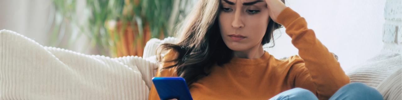 Women worried looking at phone
