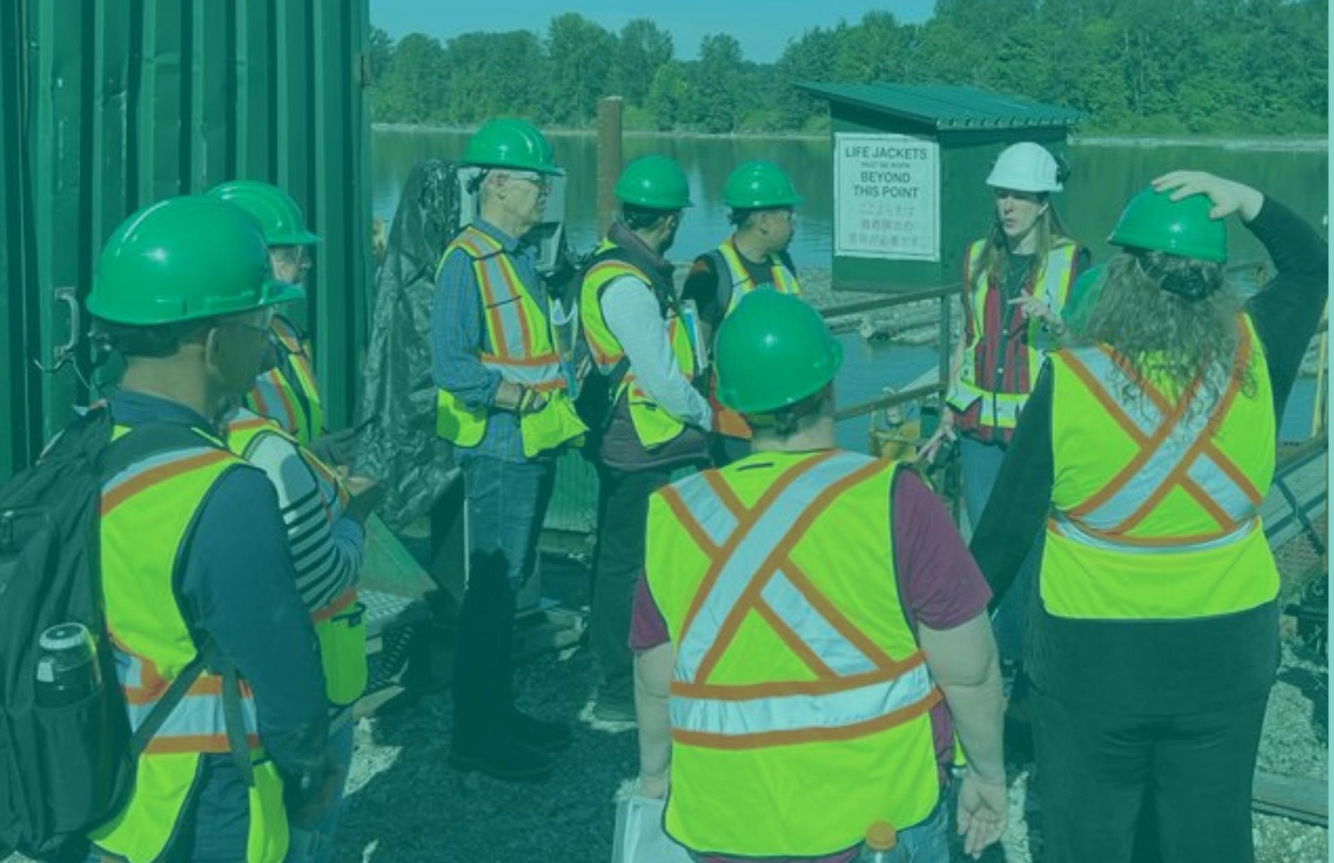 YWCA Skills for Success Participants wearing safety vests and visiting a factory