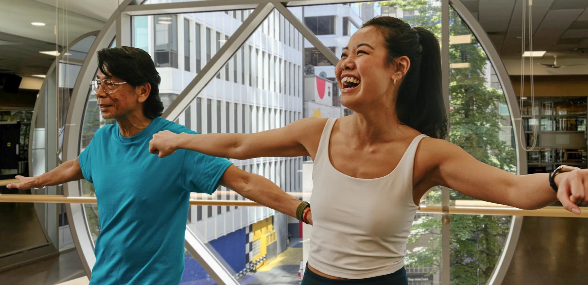 Two people stretching