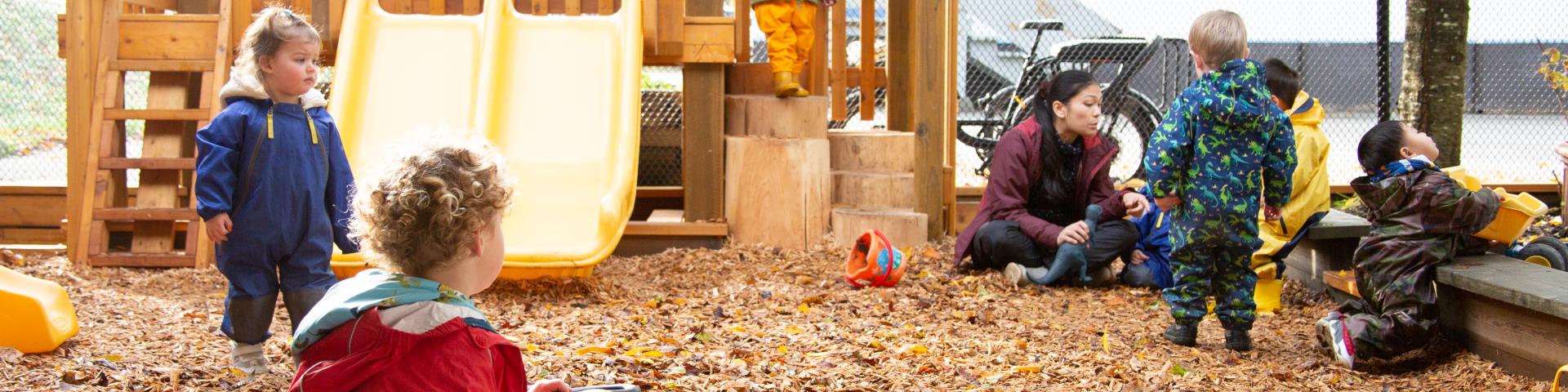 Children and educator at YWCA child care centre playground