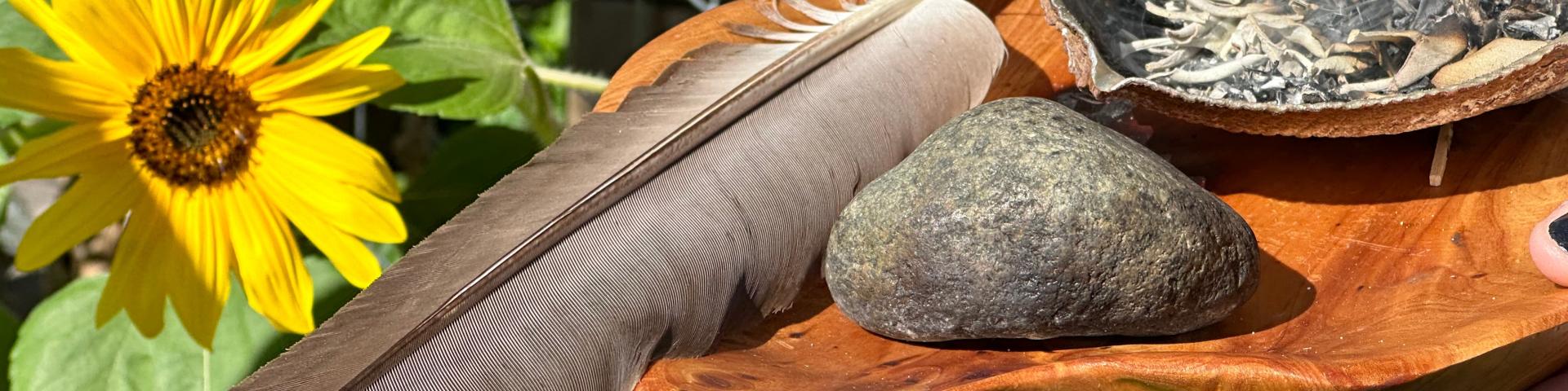 Indigenous artefacts against a garden background