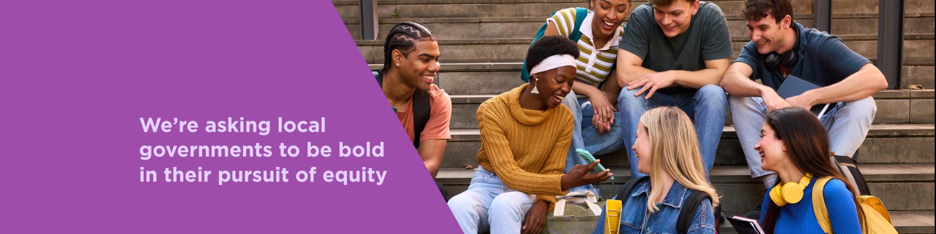 Graphic with purple background and diagonal light purple banner on the bottom with a YWCA Metro Vancouver and YWCA City Shift logo. Text reads: "We’re asking local governments to be bold in their pursuit of equity". Image of young people sitting on steps on the right hand side. 
