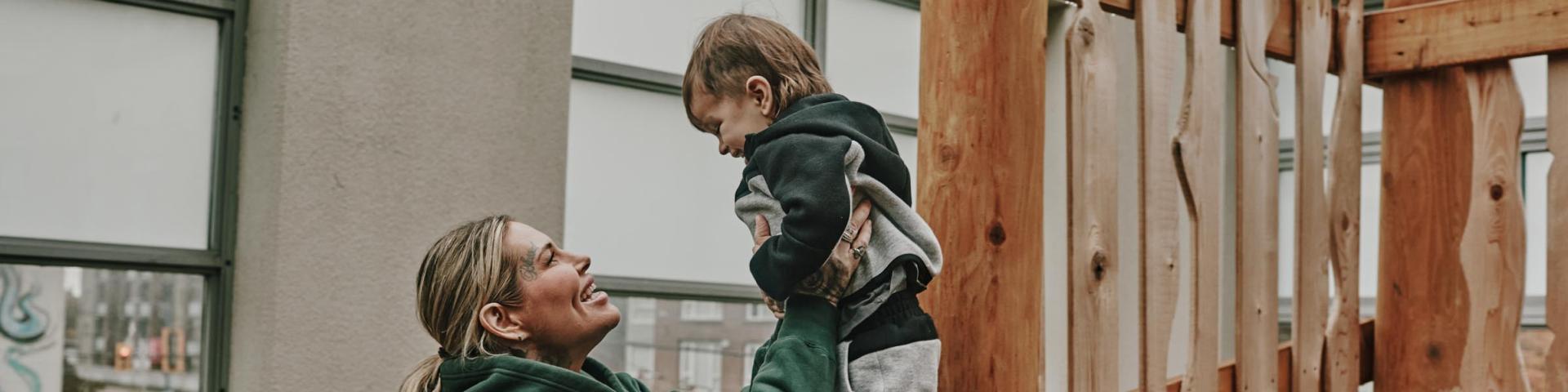 Mom and son on a jungle gym