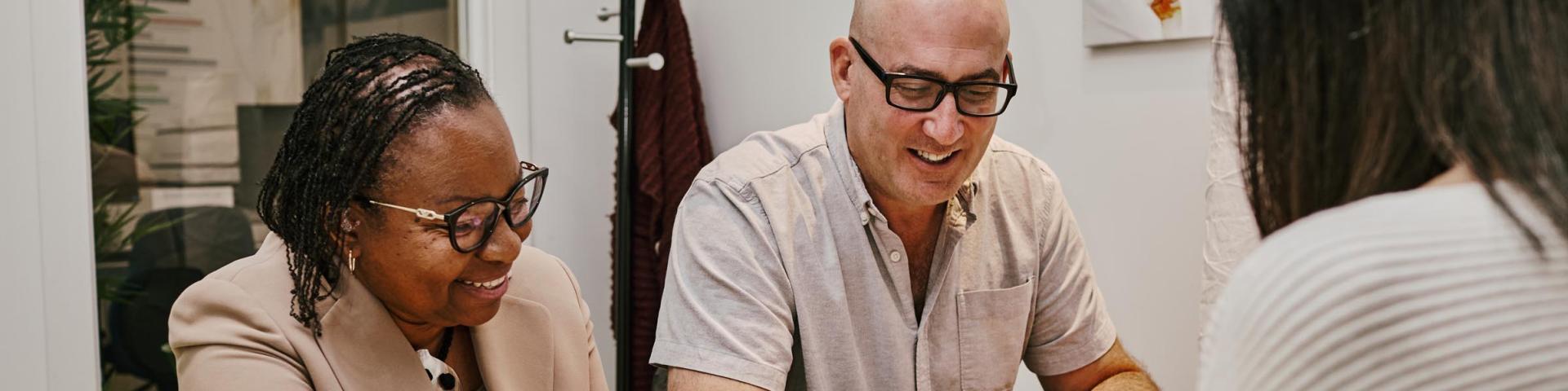 People reviewing documents together