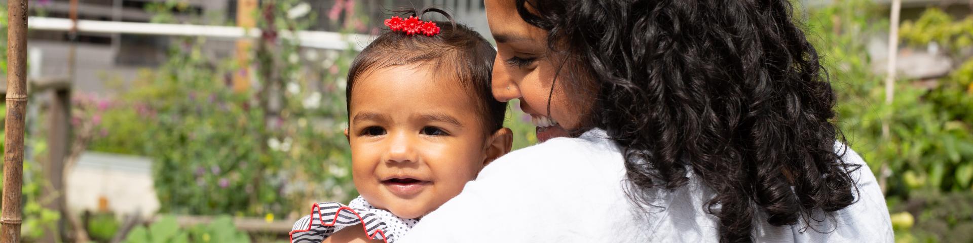 Mother and daughter looking at each other, smiling