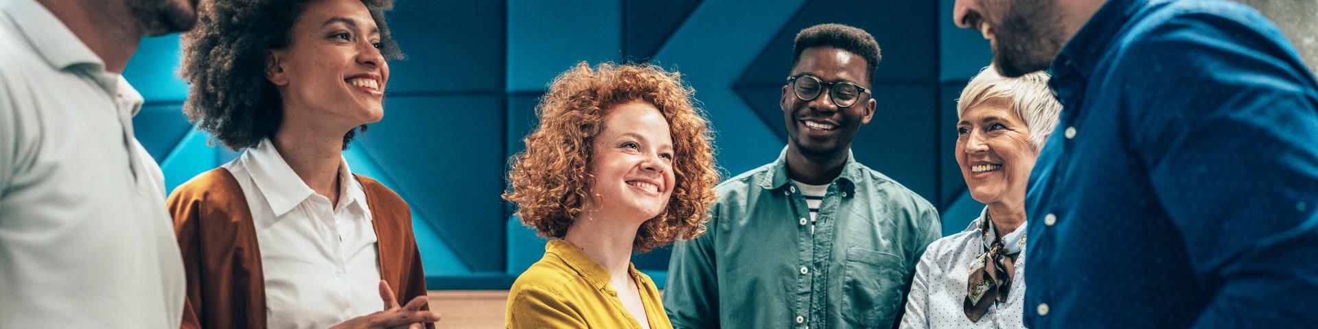 Happy businesswoman shaking hands with her colleague on a meeting in the office