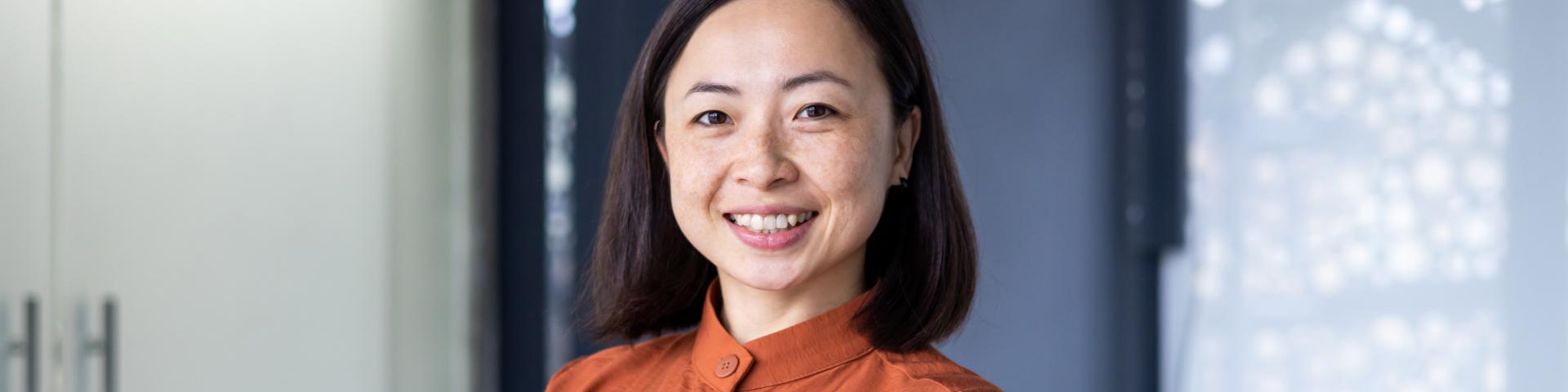 Asian woman in a power pose