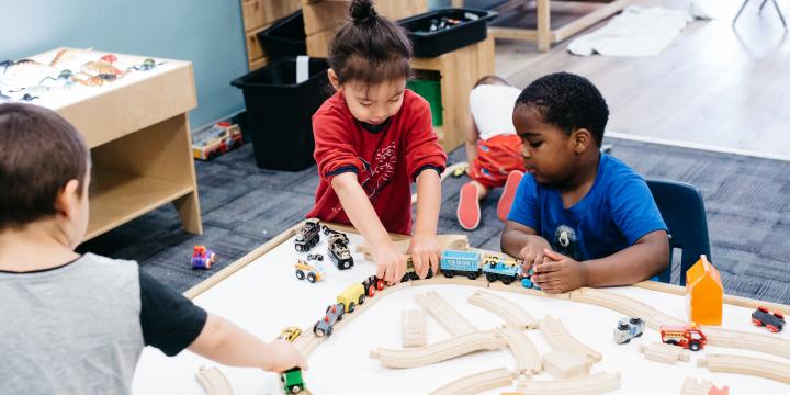 Children and care giver play at YWCA Crabtree Corner Child Care Centre