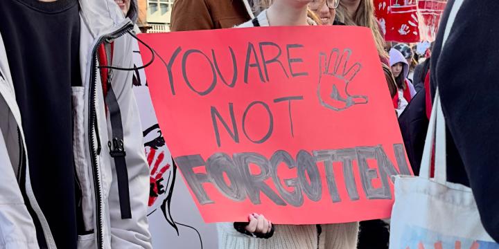 sign at a march saying "you are not forgotten"