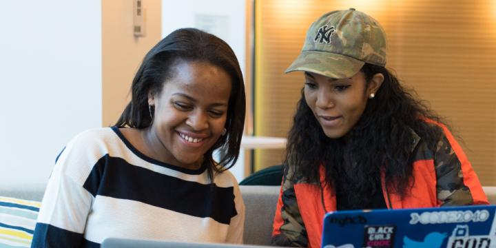 Two women working together