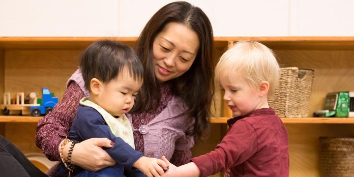 Children and care giver at Emma's Early Learning and Child Care Centre