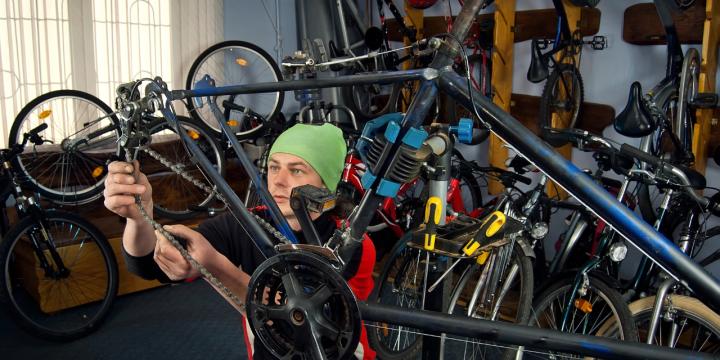 Someone repairing bikes