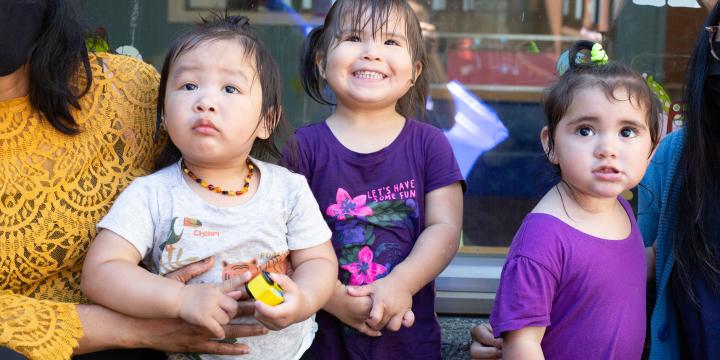 Children and care giver play at YWCA Crabtree Corner Child Care Centre