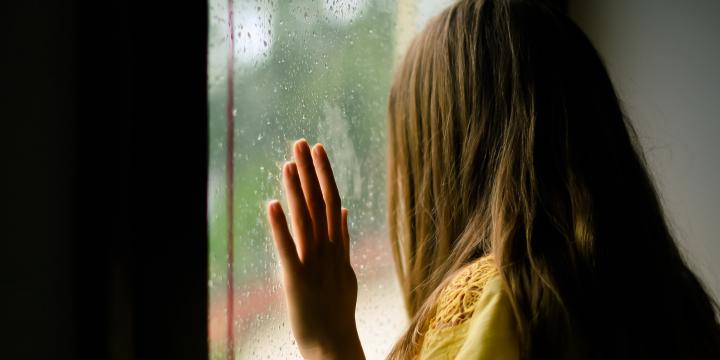 Woman looking outside the window
