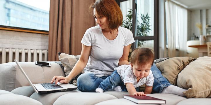 Woman working and taking care of baby