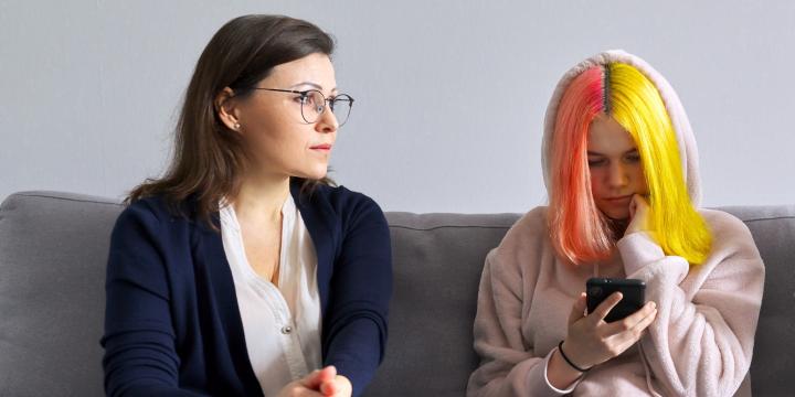 Teen talking with two adults