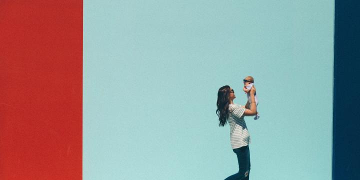 Woman carrying a baby while walking