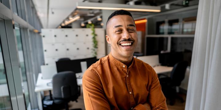 Portrait of a gay businessman on the office