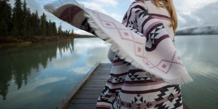 Coast Salish blanket in a scenic landscape