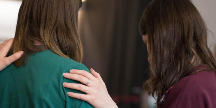 Friends offering helping hand