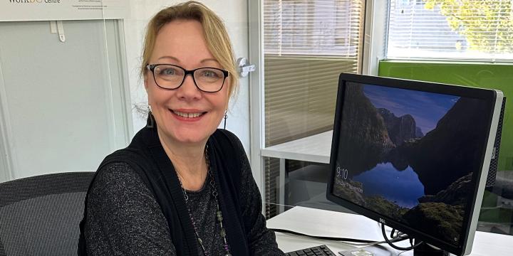 Erica Jones at desk 