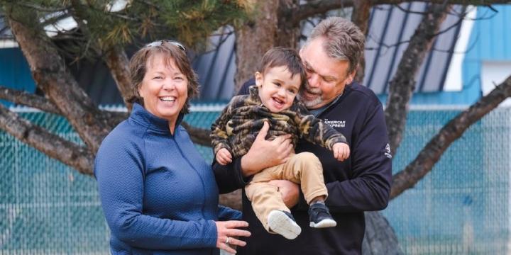 Dana Lee Harris with her husband and grandchild - photo submitted.