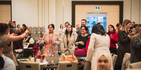 YWCA staff gather to celebrate our annual Holiday Breakfast at JW Marriott Parq Vancouver.  
