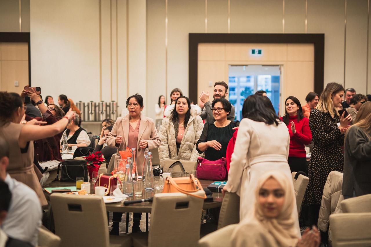 YWCA staff gather to celebrate our annual Holiday Breakfast at JW Marriott Parq Vancouver.  