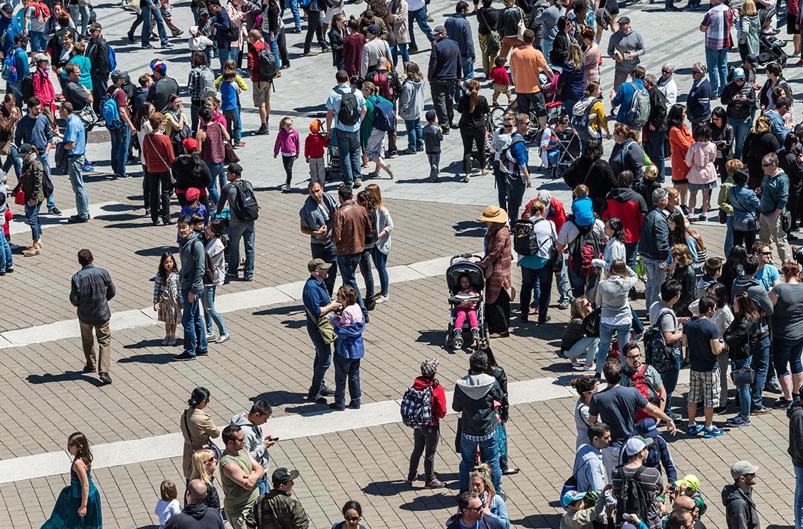 An aerial photo of a crowd of people on a public plaza