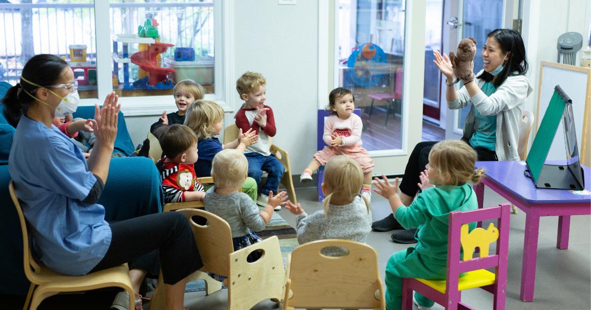 Early Chilhood Educators play with children at YWCA Emma’s Early Learning and Child Care Centre.