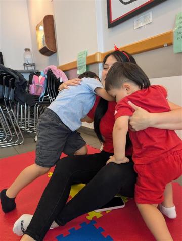 Mom hugging her kids
