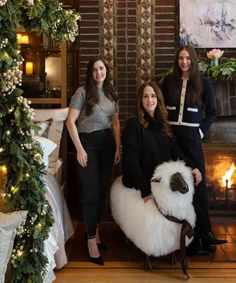 Mother with two daughters in a Christmas setting