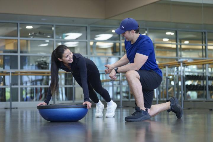 2 individuals training in gym